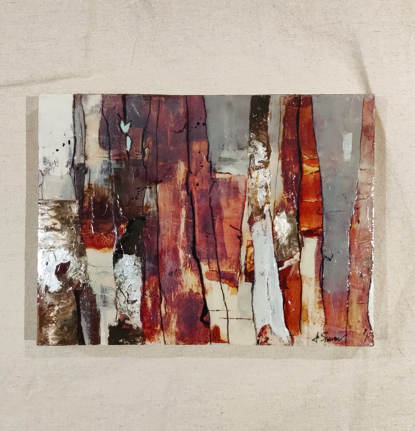 Close-up of 'Glimmer,' showcasing rich, weathered textures with hints of metallic paint catching the light in the trees.