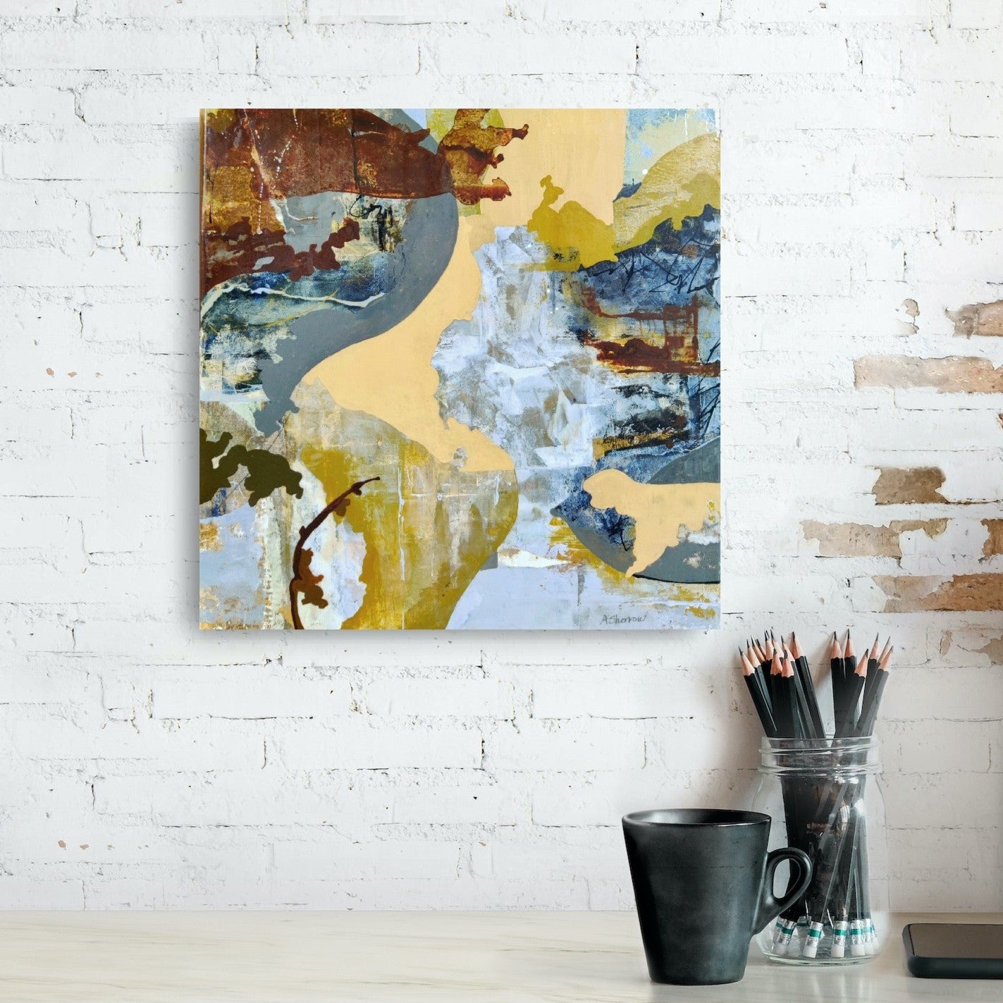 Artwork 'Cascade' captures the movement and flow of water with contrasting deep blues and warm golds, evoking both stillness and motion.