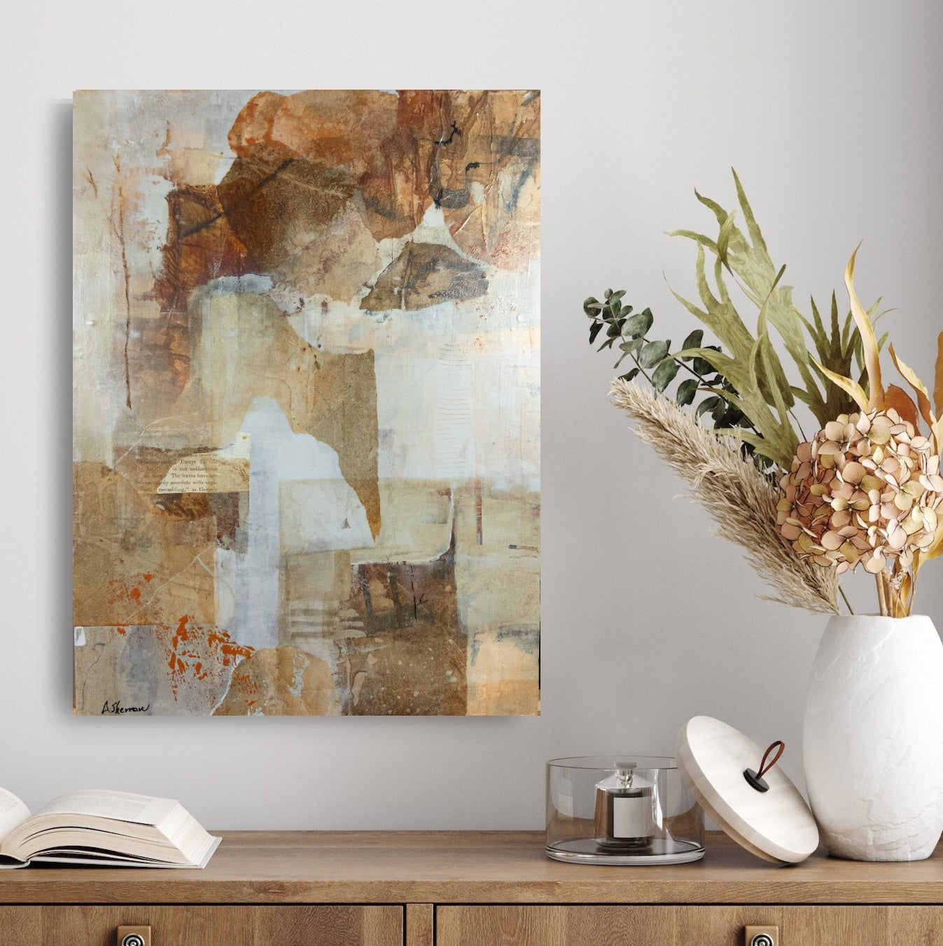 Deep Forest, an abstract mixed media painting, is elegantly displayed in a bright entryway. Its warm earth tones and organic textures create an inviting first impression, setting a tranquil and artistic tone for the space. The artwork’s subtle markings and rich details add depth, seamlessly blending with the welcoming atmosphere.