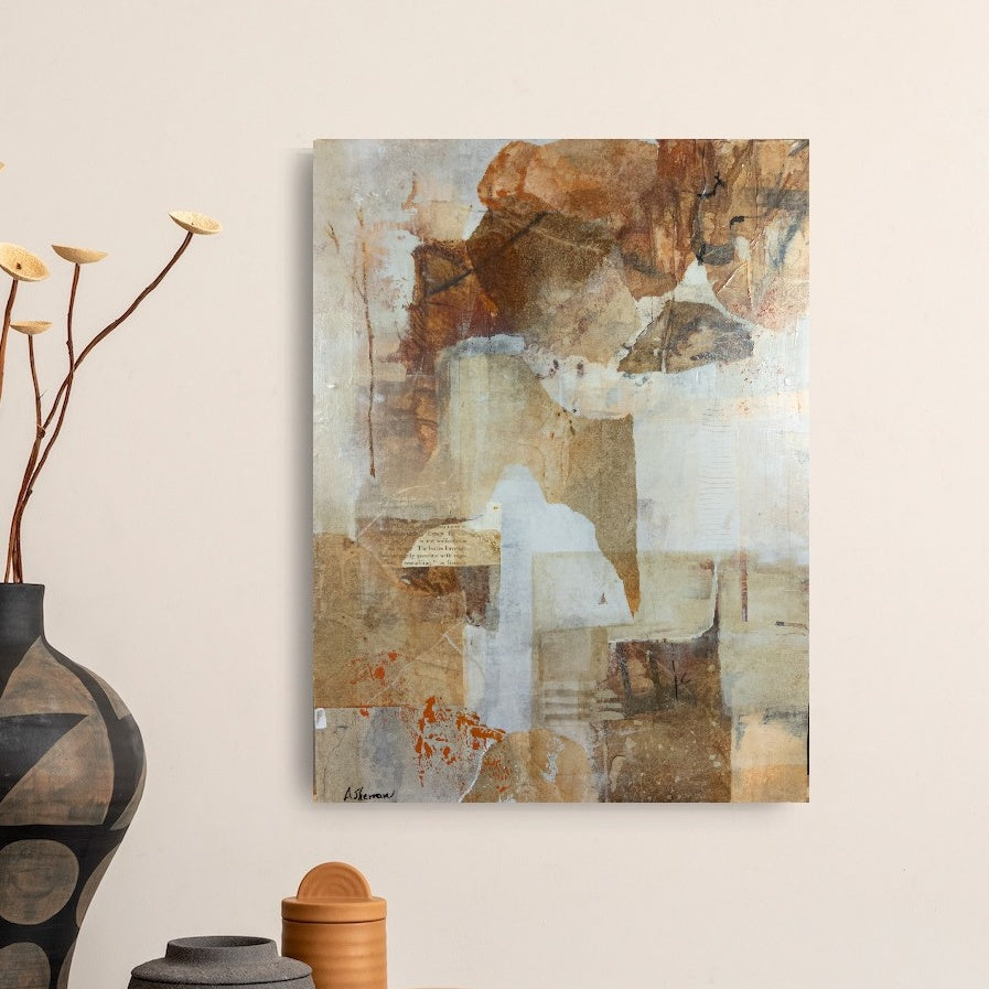 Deep Forest, an abstract mixed media painting, is displayed in a cozy living room. Its warm earth tones and organic textures harmonize with the inviting space, adding a touch of natural elegance. Soft lighting enhances the intricate details, while the artwork’s depth and subtle markings create a serene, grounding presence in the room.