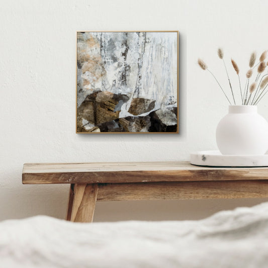 Abstract mixed media painting titled 'Clearing by Noon' with earthy tones, metallic accents, and layered textures resembling a forest landscape.