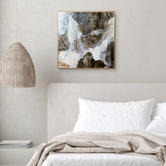 "A Chill in the Air" displayed above a neutral-toned bed with soft linens and a woven lamp, complementing a cozy, nature-inspired bedroom setting.
