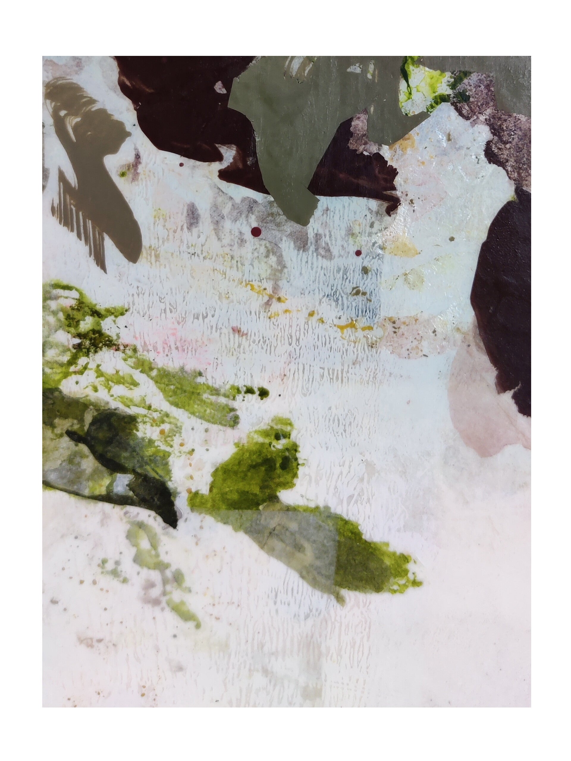 Abstract art with splashes of green, brown, and white on a textured surface