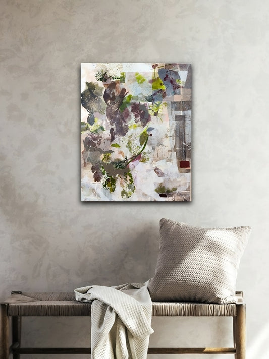 Abstract painting on a wall above a bench with a pillow