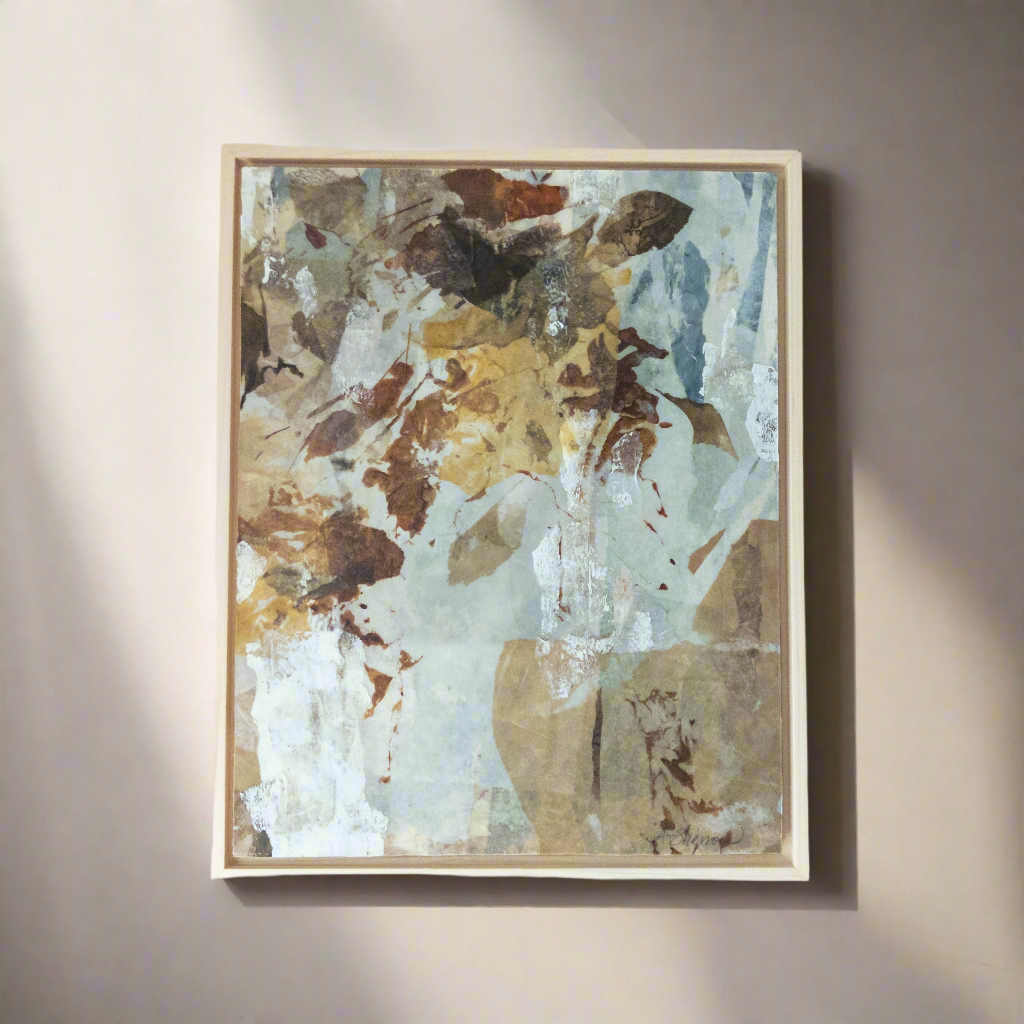 Abstract painting in a wooden frame on a beige wall